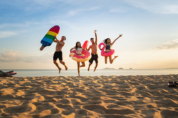 ToDoOntario-summer-family-jumping-beach.jpg