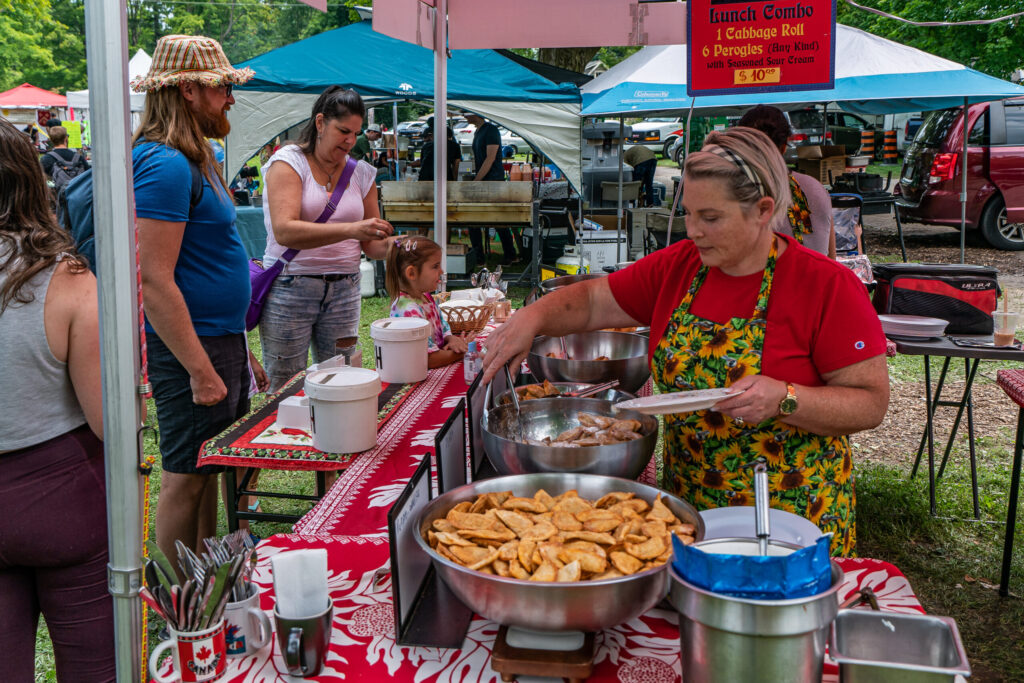 Peterborough-PKT-Peterborough-Folk-Festival-Food-Vendor-Area-Perogies-Customers-scaled.jpg
